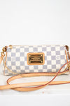 Louis Vuitton handbag with checkered pattern on a white background