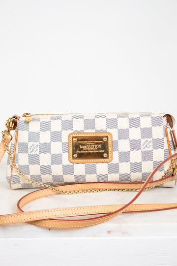 Louis Vuitton handbag with checkered pattern on a white background