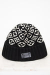 Black beanie with white pattern on a white background