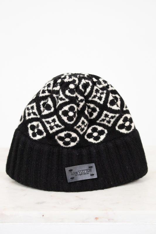 Black beanie with white pattern on a white background