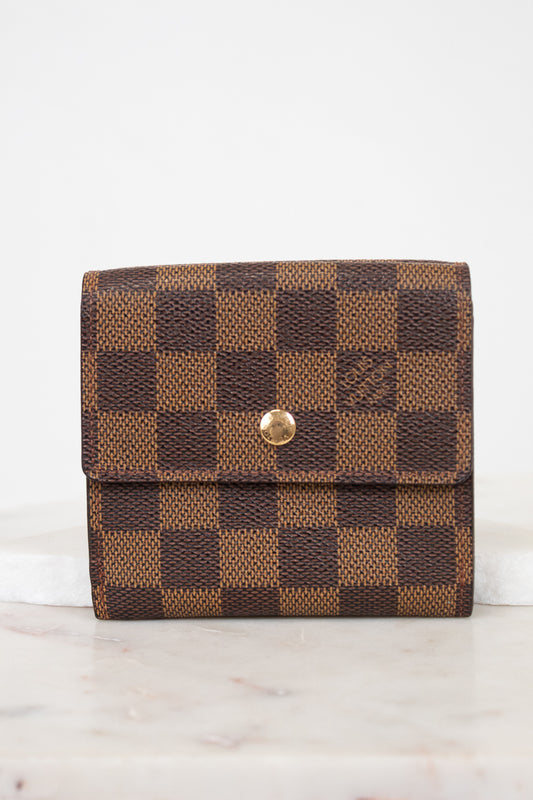 Brown checkered wallet with gold snap button on a white background