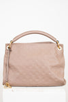 Beige handbag with gold accents on a white background