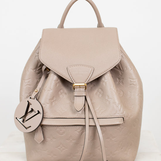 Beige backpack with a brand logo on a white background