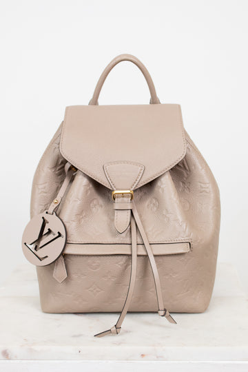 Beige backpack with a brand logo on a white background