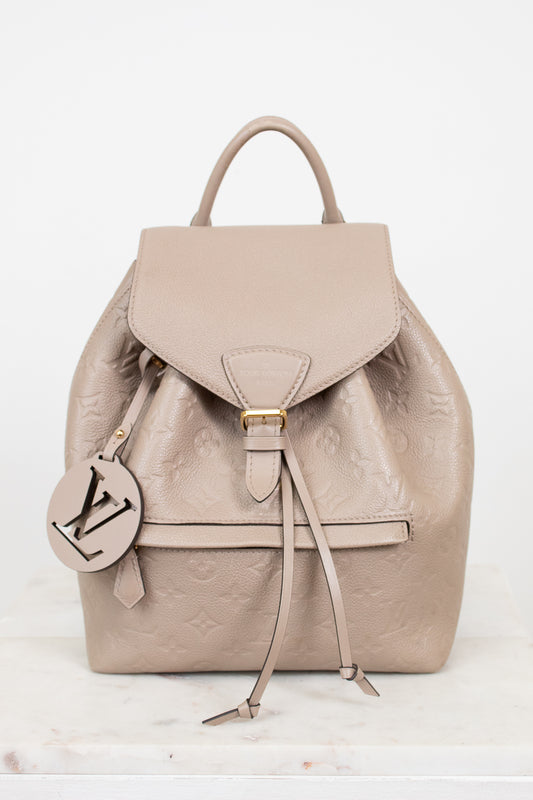 Beige backpack with a brand logo on a white background