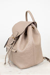 Beige backpack with a subtle logo pattern on a white background