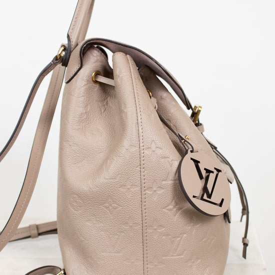 Beige handbag with a brand logo on a white background