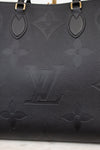 Black handbag with brand logo on a light background