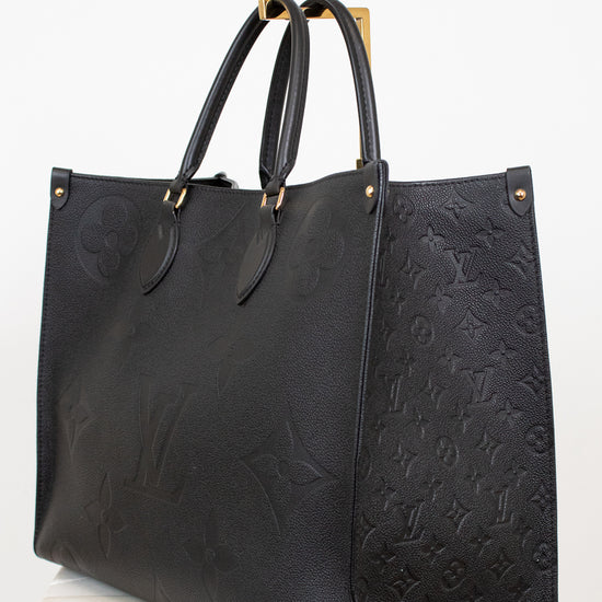Black embossed handbag on a white background