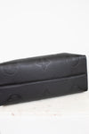 Bottom view of black bag with embossed logo on a white background