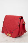 Red handbag with gold accents on a light gray background