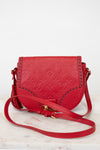Red handbag with gold accents on a white background