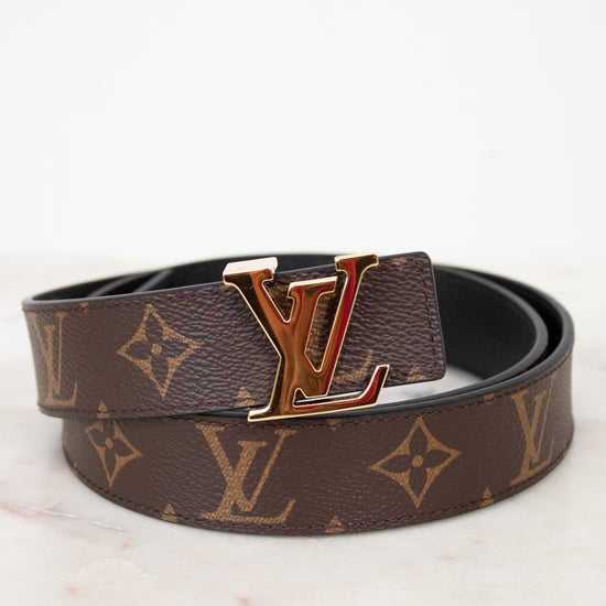 Louis Vuitton belt with monogram pattern on a light background
