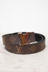 Louis Vuitton belt with monogram pattern on a light background