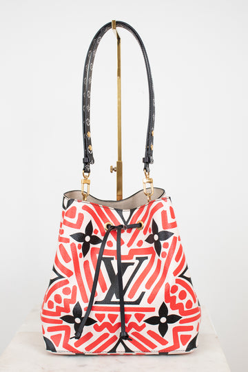 Designer handbag with a colorful pattern on a white background