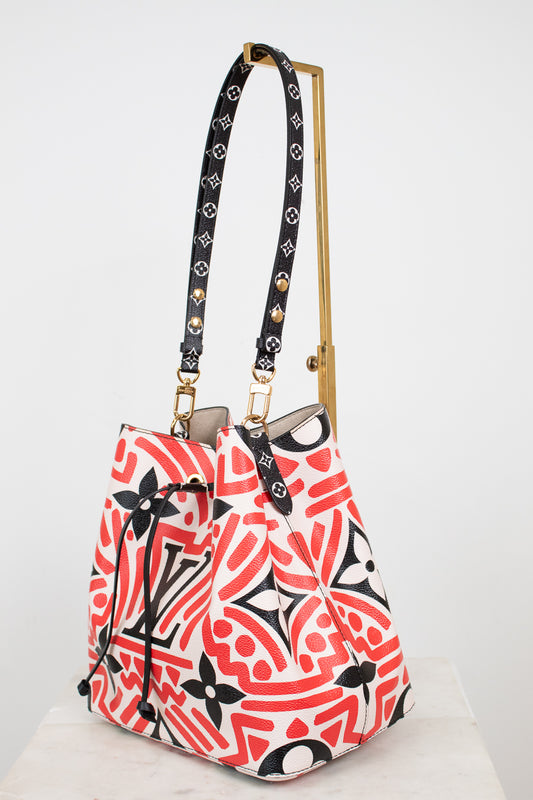 Patterned handbag with a strap on a white background