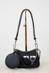 Black handbag with a matching round pouch on a light gray background