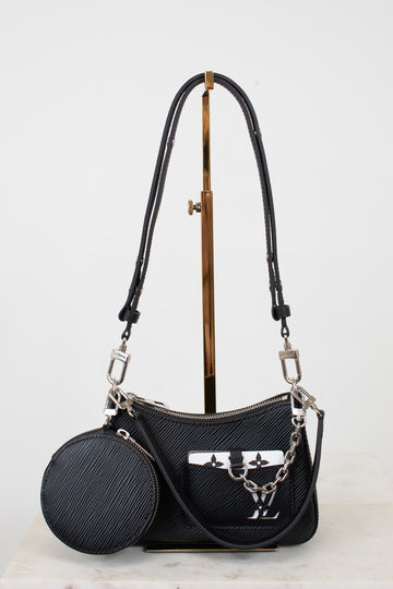 Black handbag with a matching round pouch on a light gray background