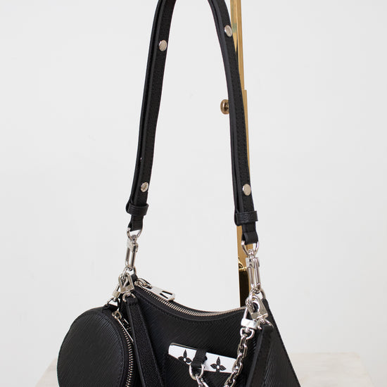 Black handbag with a chain detail on a white background