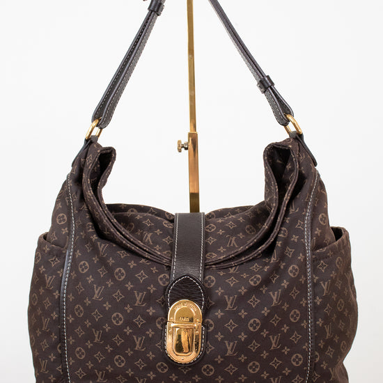 Brown handbag with gold accents on a white background