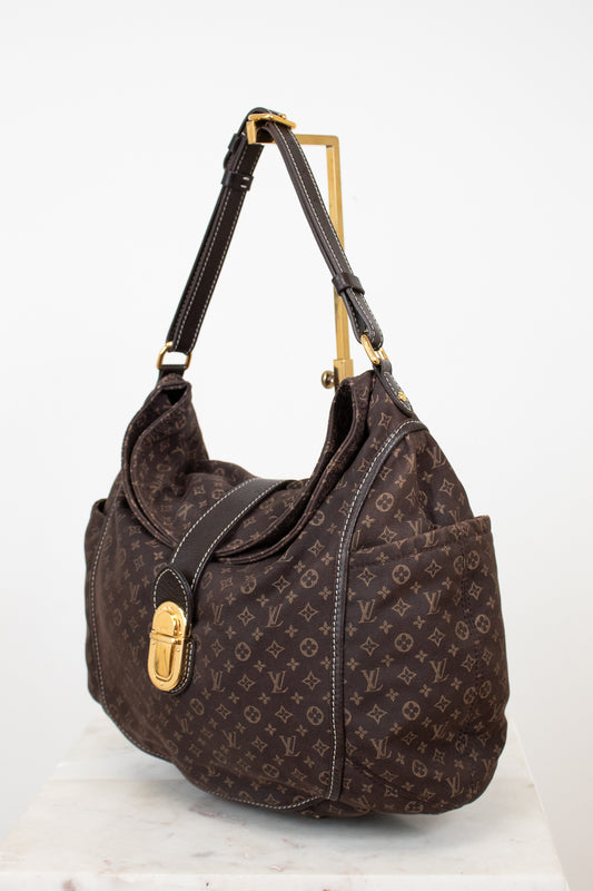 Brown handbag with gold accents on a white background