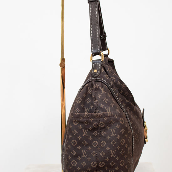 Brown monogram shoulder bag on a white background