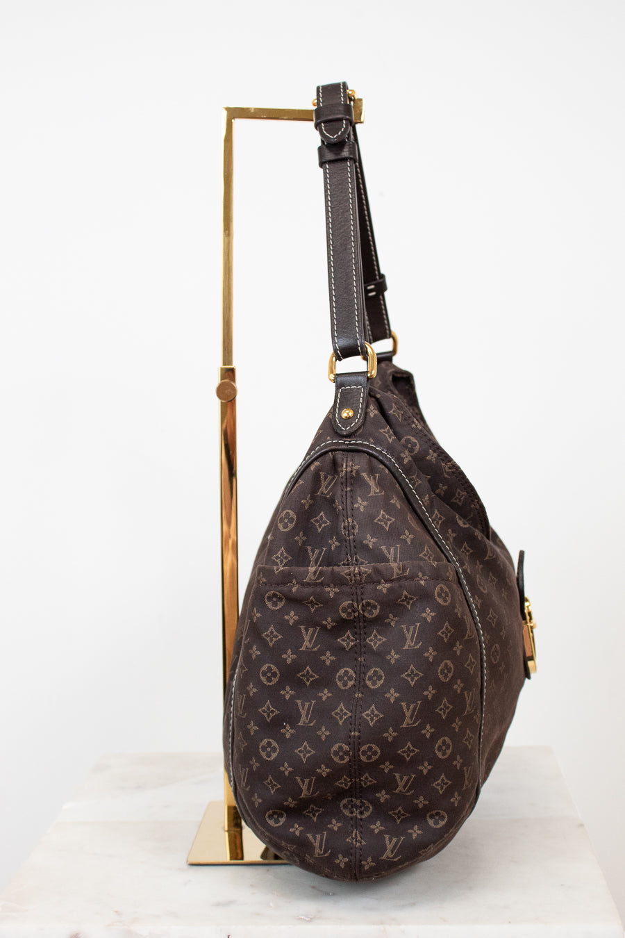 Brown monogram shoulder bag on a white background