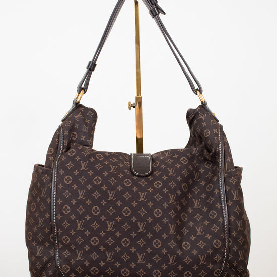 Brown patterned handbag on a white background