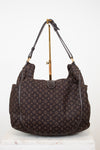 Brown patterned handbag on a white background