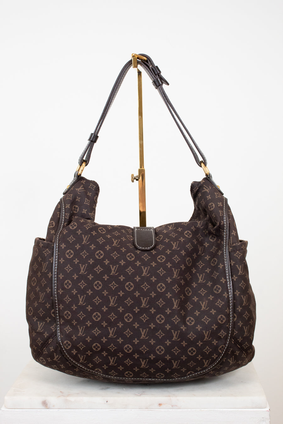 Brown patterned handbag on a white background