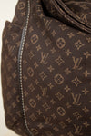 Brown bag with monogram pattern on a white background