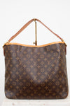 A Louis Vuitton monogram coated canvas shoulder bag with a tan leather strap and gold-tone hardware, displayed against a plain white background.