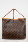Louis Vuitton monogram coated canvas shoulder bag with a brown leather handle and gold-tone hardware, displayed against a plain white background.