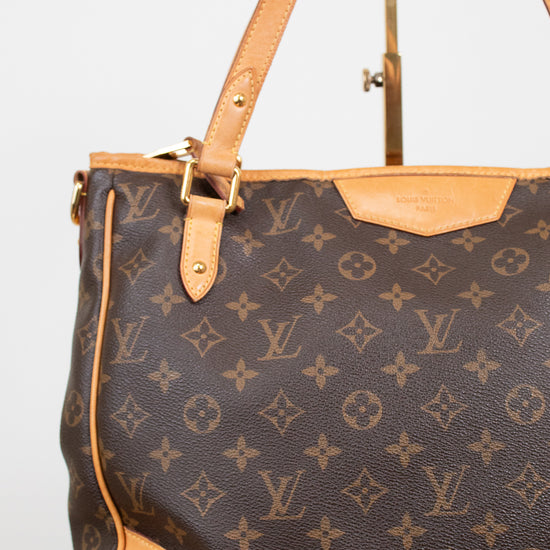 Louis Vuitton monogram coated canvas shoulder bag with tan leather trim and gold-tone hardware, shown against a plain light background.