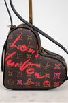Heart-shaped Louis Vuitton bag with red and pink graffiti-style text on a white background