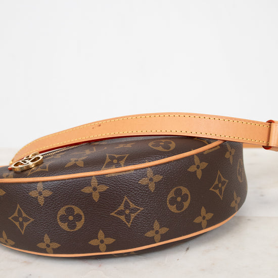 Louis Vuitton monogram handbag on a marble surface