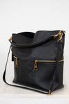 Black handbag with gold accents on a white background
