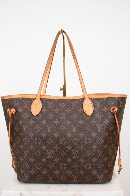 Louis Vuitton handbag with monogram pattern on a white background
