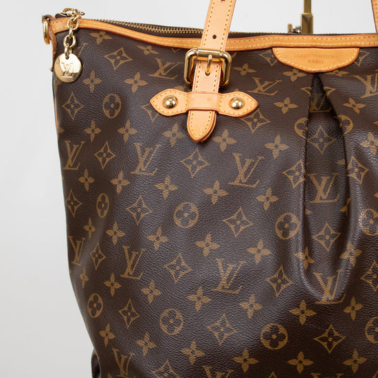 Brown Louis Vuitton handbag with monogram pattern on a white background