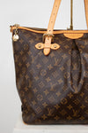 Brown Louis Vuitton handbag with monogram pattern on a white background