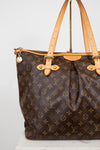 Louis Vuitton handbag with monogram pattern on a white background