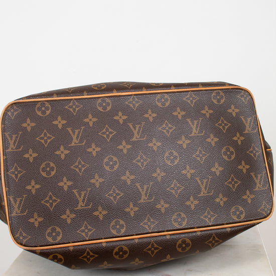 Brown Louis Vuitton monogram bag on a white background