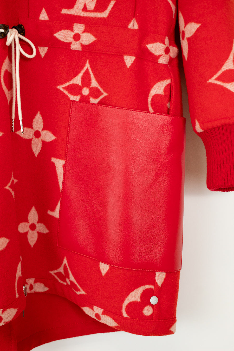 Red garment with pink pattern on a white background