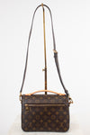 Louis Vuitton monogram shoulder bag in dark brown coated canvas with gold-tone hardware, displayed on a white background with a stand.