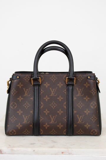 Brown monogram handbag with black handles and trim on a white background