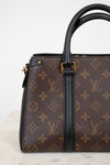 Louis Vuitton handbag with monogram pattern on a light background