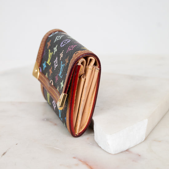 Designer wallet with colorful pattern on a marble surface