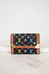 Black wallet with colorful monogram pattern on a white background