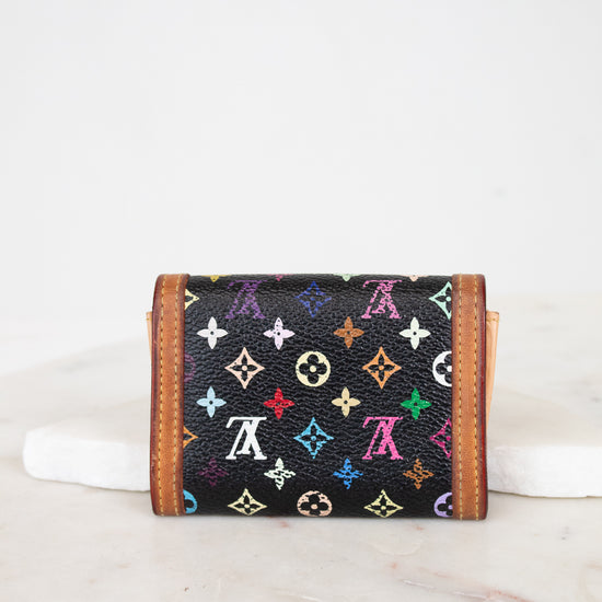 Multicolored monogram wallet on a white background