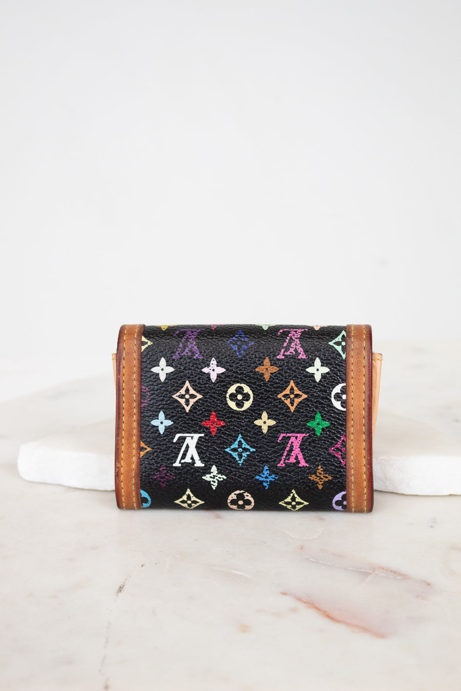 Multicolored monogram wallet on a white background